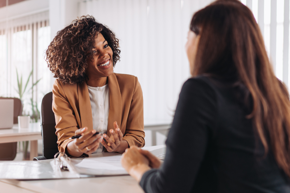 Woman smiling at another woman – How to Use HARO for SEO