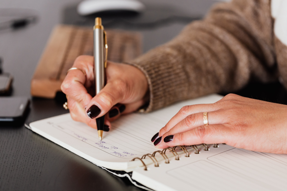 A woman writing notes - soap notes private practice