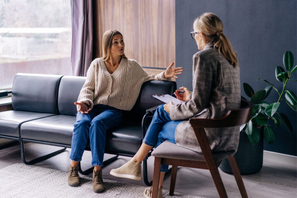 Therapist and woman talking in a comfortable office